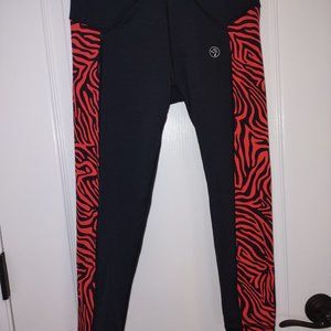 Zumba capris black w/ red animal stripe down sides. Small. EUC